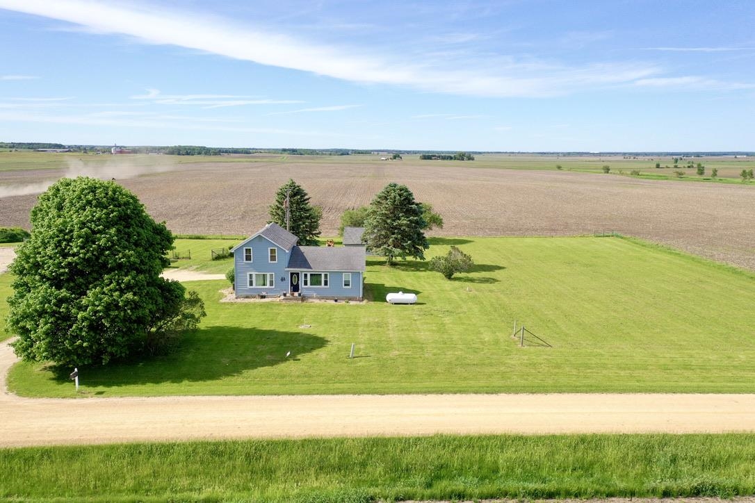 10784 East Utility Road Stillman Valley, IL 61084 - Photo 4 of 23 a view of a lake with a yard