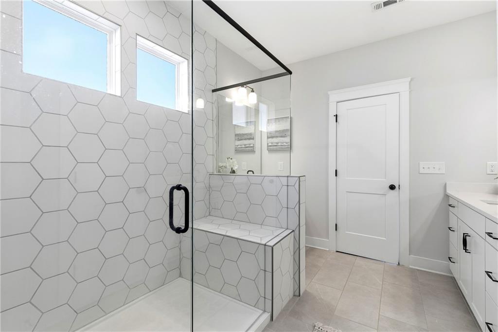 203 Sunshower Ridge Canton, GA 30114 - Photo 23 of 58 a bathroom with a shower