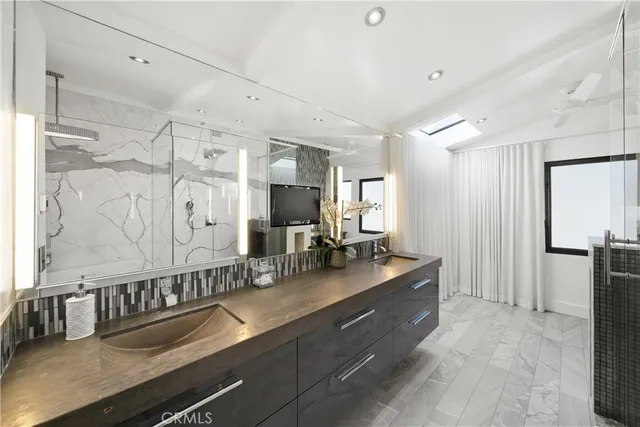 a bathroom with double vanity and a sink