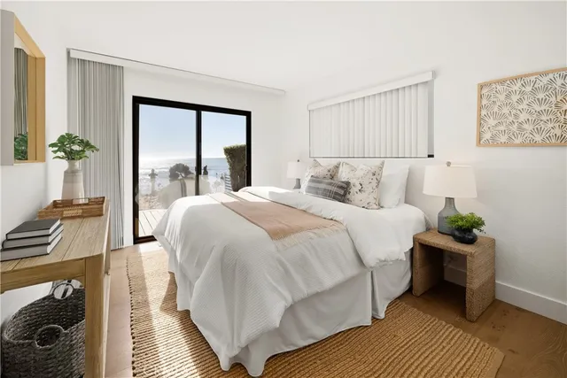 a bedroom with bed and large window