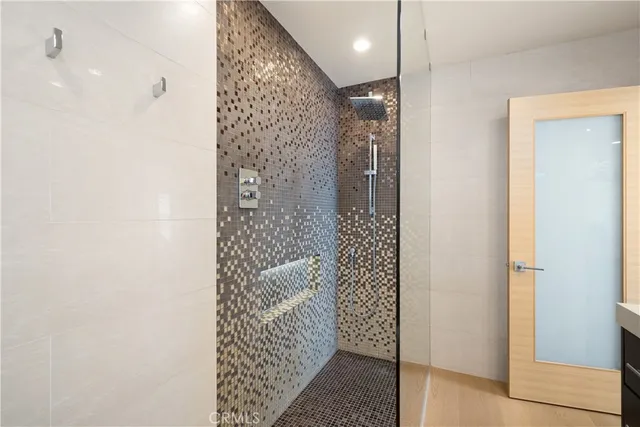 a view of house with a big yard and potted plants