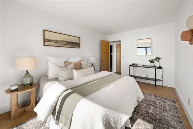 a view of a patio with table and chairs potted plants