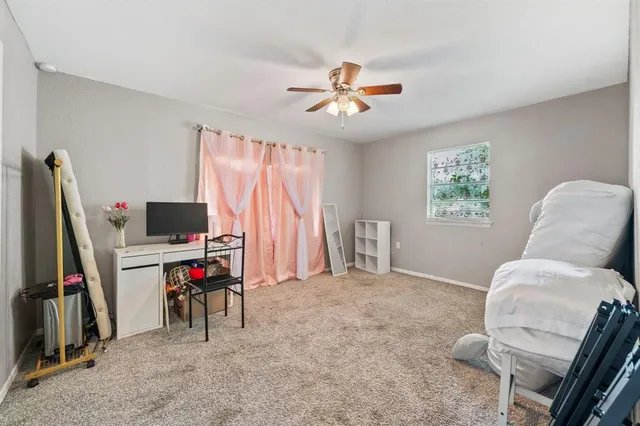 a view of a livingroom with a workspace