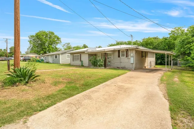 a view of a house with a swimming pool