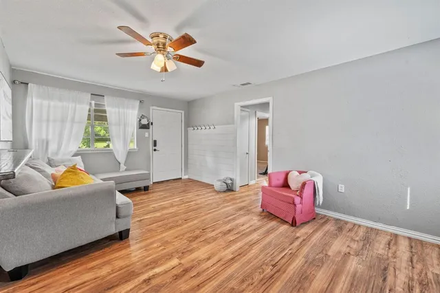 a living room with furniture and a large window