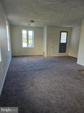 a kitchen with wooden cabinets and a stove top oven