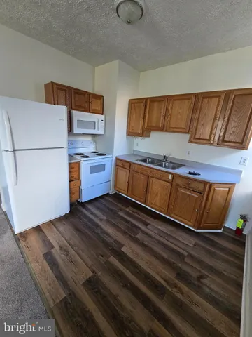 a bathroom with a toilet sink and window