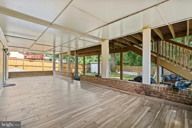 a view of porch with wooden floor