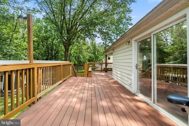 a view of deck with wooden floor and outdoor seating