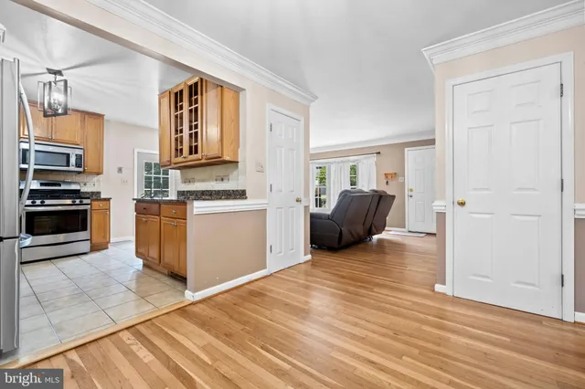 a kitchen with a stove and a refrigerator