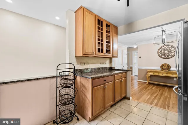 a kitchen with stainless steel appliances granite countertop a stove and a sink