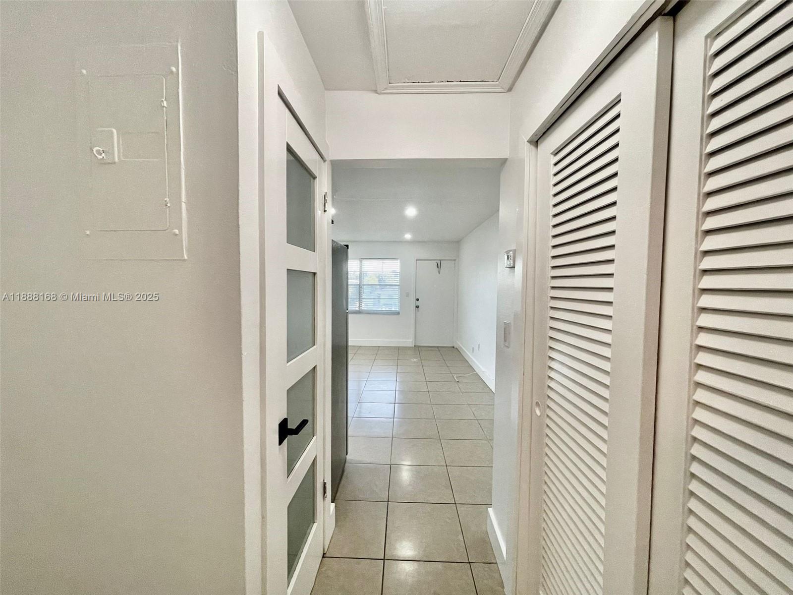 2255 Southeast 5th Street, Unit 10 Pompano Beach, FL 33062 - Photo 4 of 10 a bathroom with a glass door shower and a sink