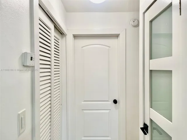 a view of a bathroom from a hallway