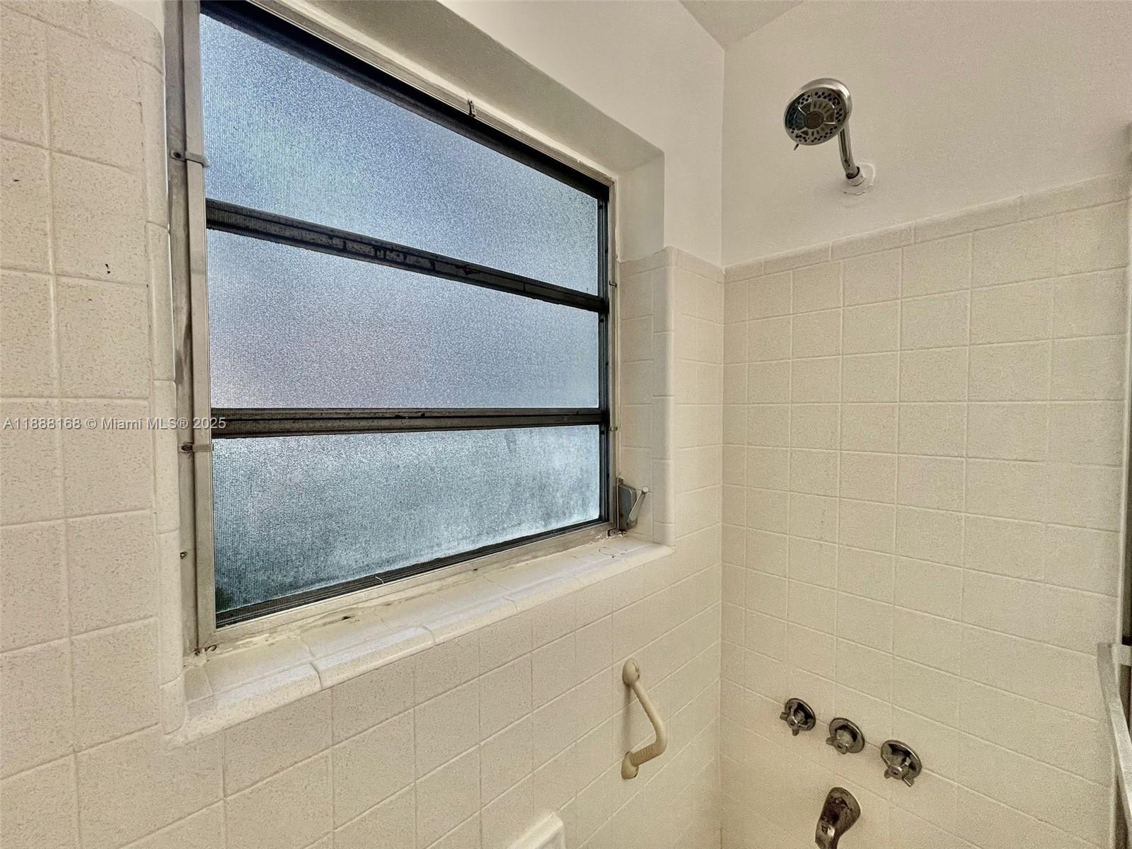 2255 Southeast 5th Street, Unit 10 Pompano Beach, FL 33062 - Photo 10 of 10 a bathroom with a shower and a sink
