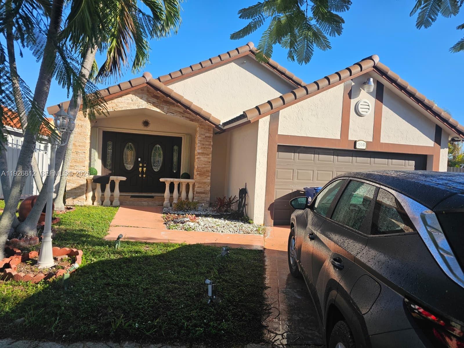 a view of a house with backyard porch and furniture