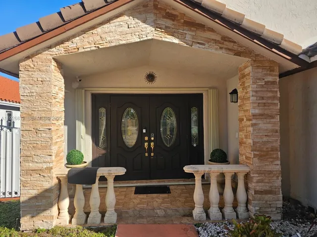 a view of a living room kitchen and a wooden floor