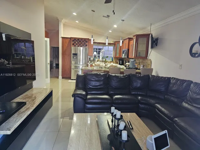 a kitchen with stainless steel appliances granite countertop a stove top oven and sink