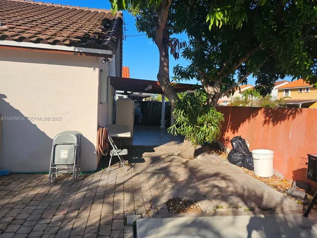 a view of a porch with wooden floor