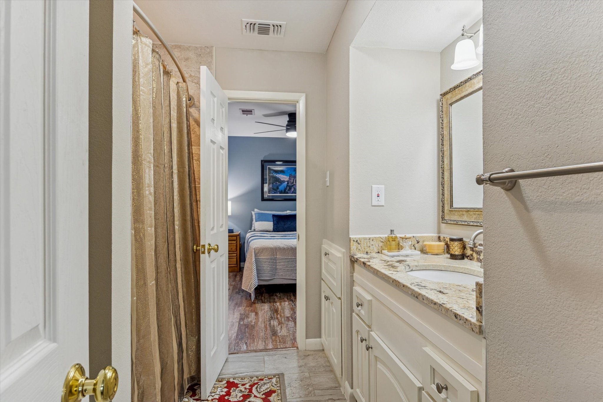 10902 Mullins Drive Houston, TX 77096 - Photo 13 of 20 a en suite bathroom with a sink double vanity and a mirror