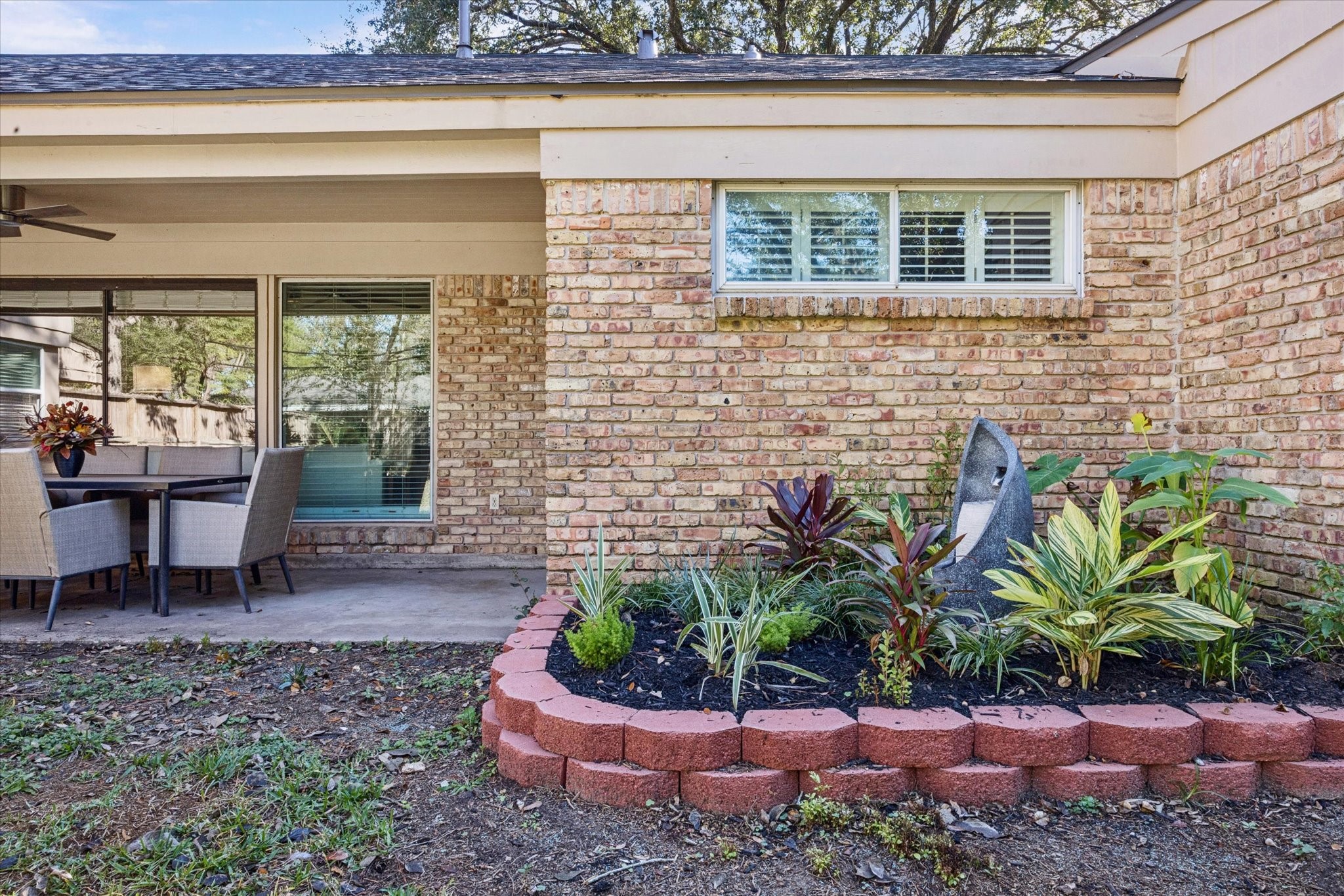 10902 Mullins Drive Houston, TX 77096 - Photo 18 of 20 a view of a backyard with plants and bench