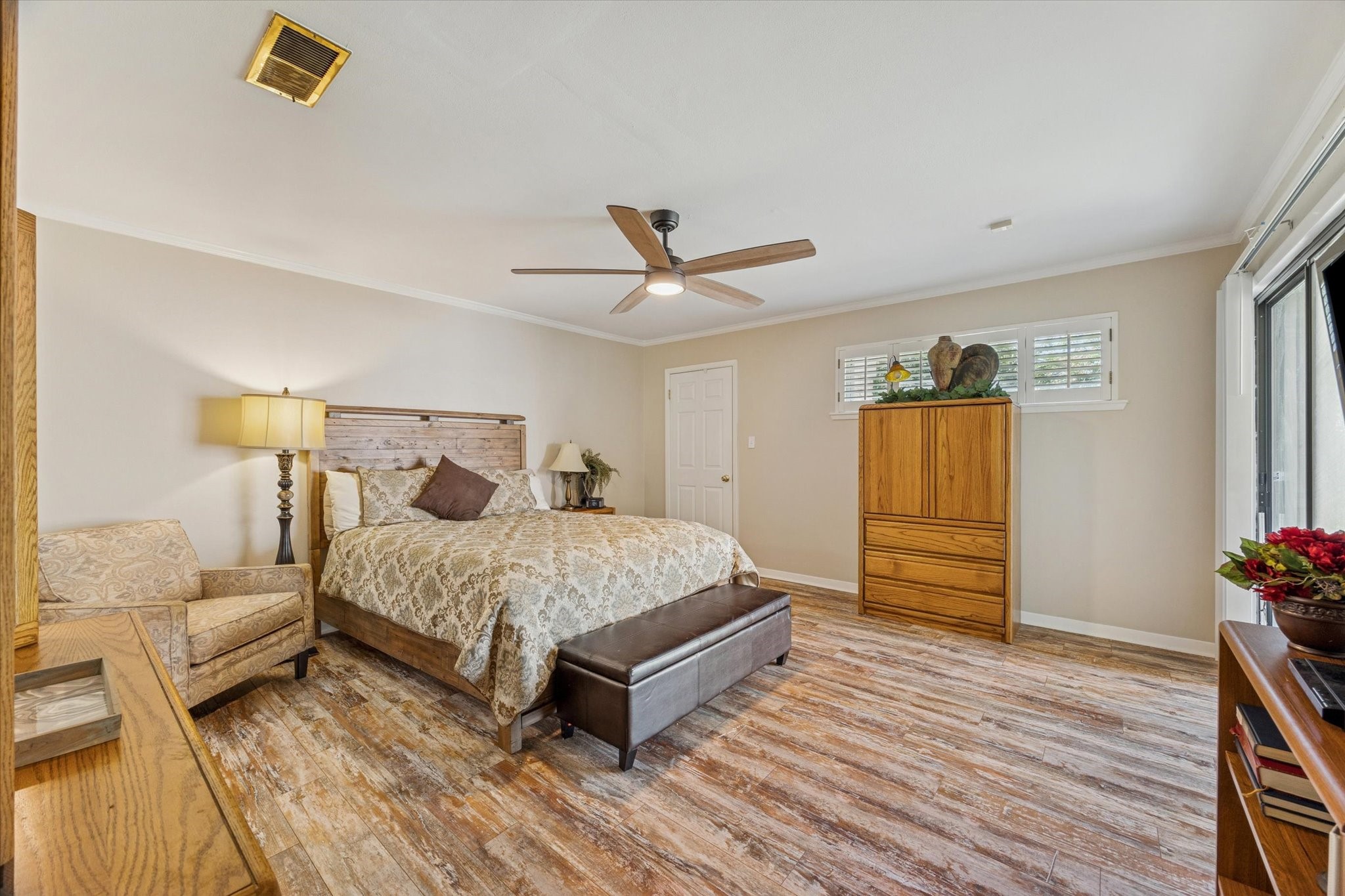 10902 Mullins Drive Houston, TX 77096 - Photo 10 of 20 a bedroom with a bed and window