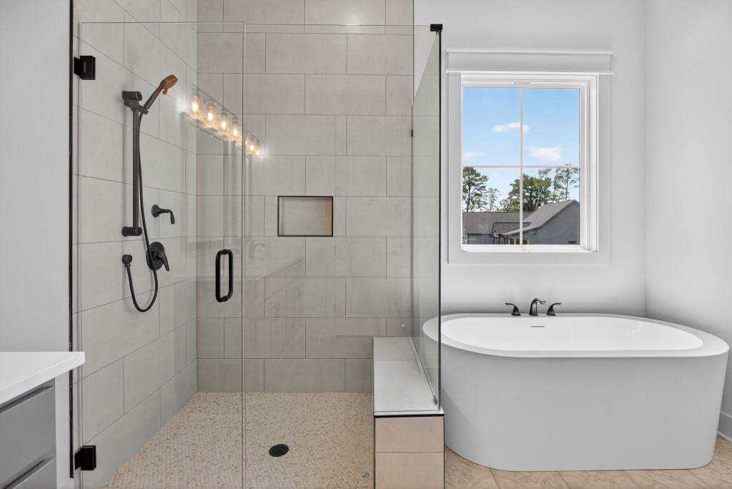62 Ridgewood Creek Path Dallas, GA 30157 - Photo 11 of 31 a bathroom with a sink a toilet and shower