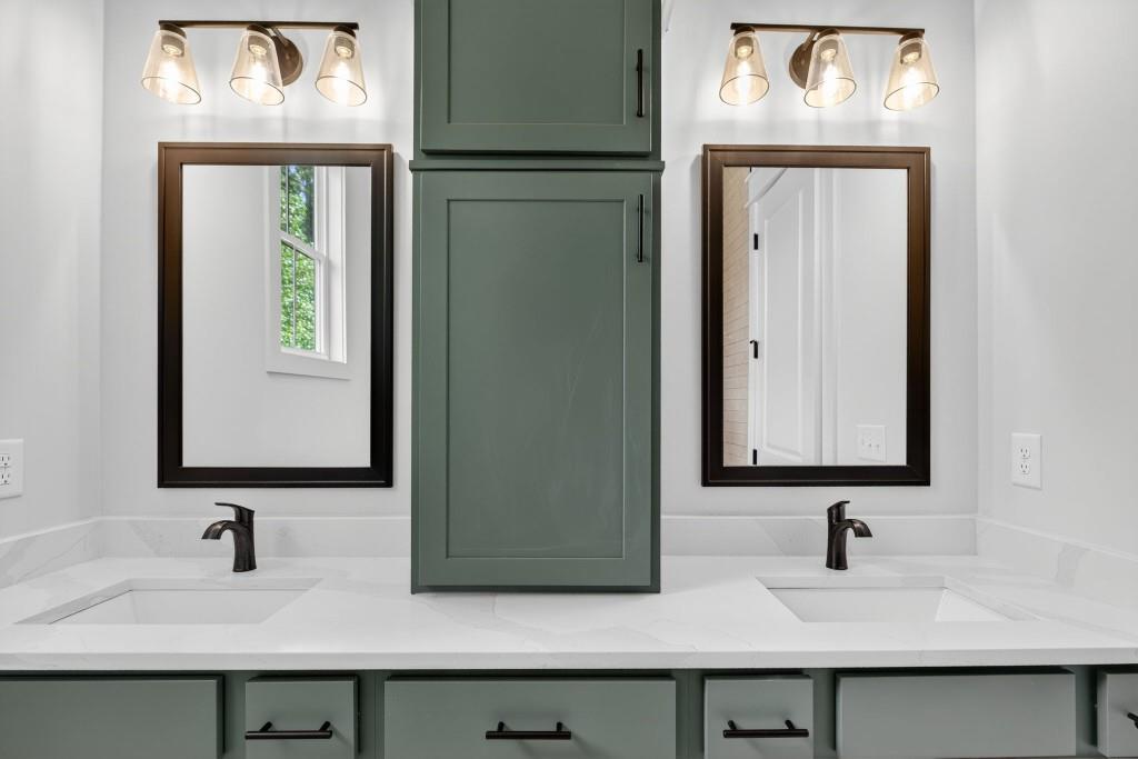 62 Ridgewood Creek Path Dallas, GA 30157 - Photo 17 of 31 a bathroom with a sink and a mirror