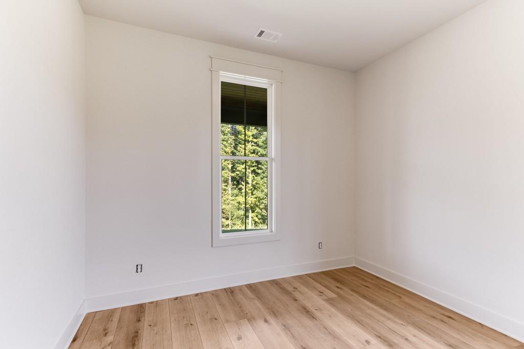 62 Ridgewood Creek Path Dallas, GA 30157 - Photo 19 of 31 an empty room with windows