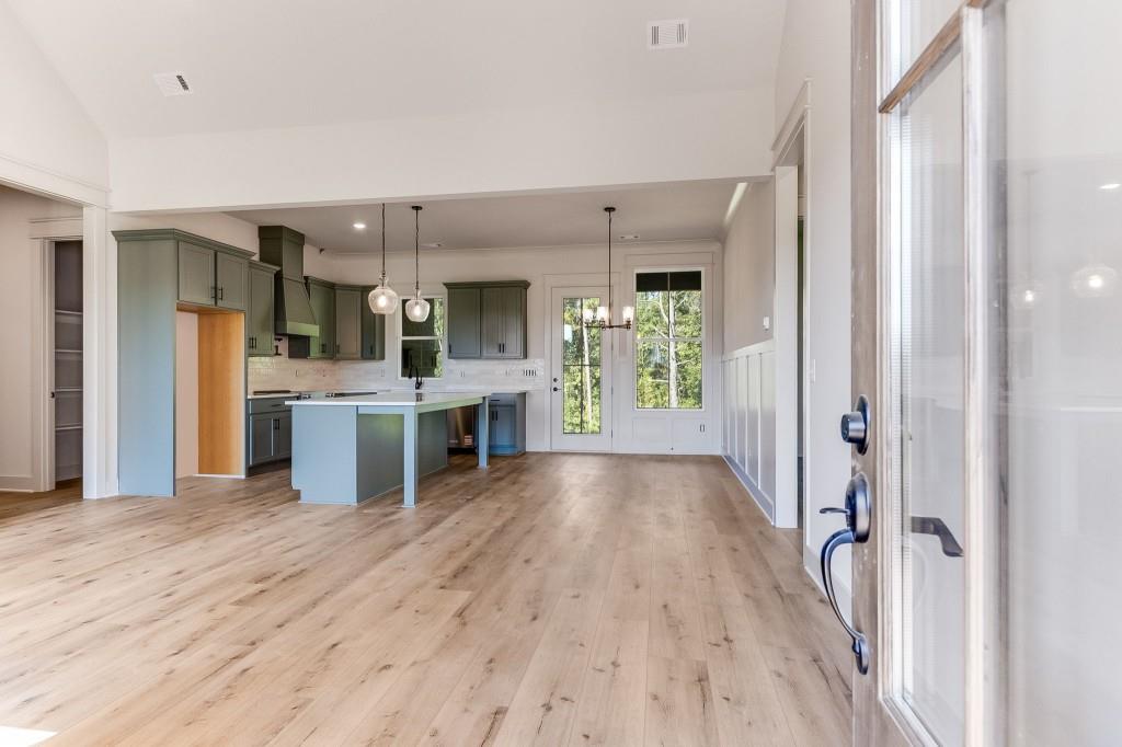 62 Ridgewood Creek Path Dallas, GA 30157 - Photo 26 of 31 a view of a kitchen with a sink refrigerator and wooden floor