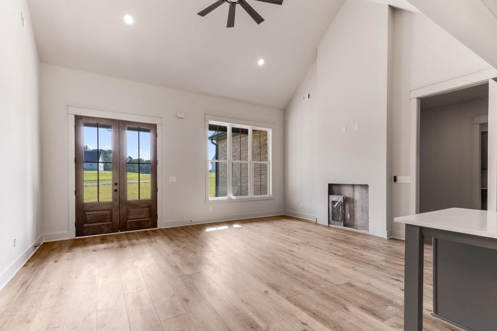 62 Ridgewood Creek Path Dallas, GA 30157 - Photo 27 of 31 a view of empty room with wooden floor and fan