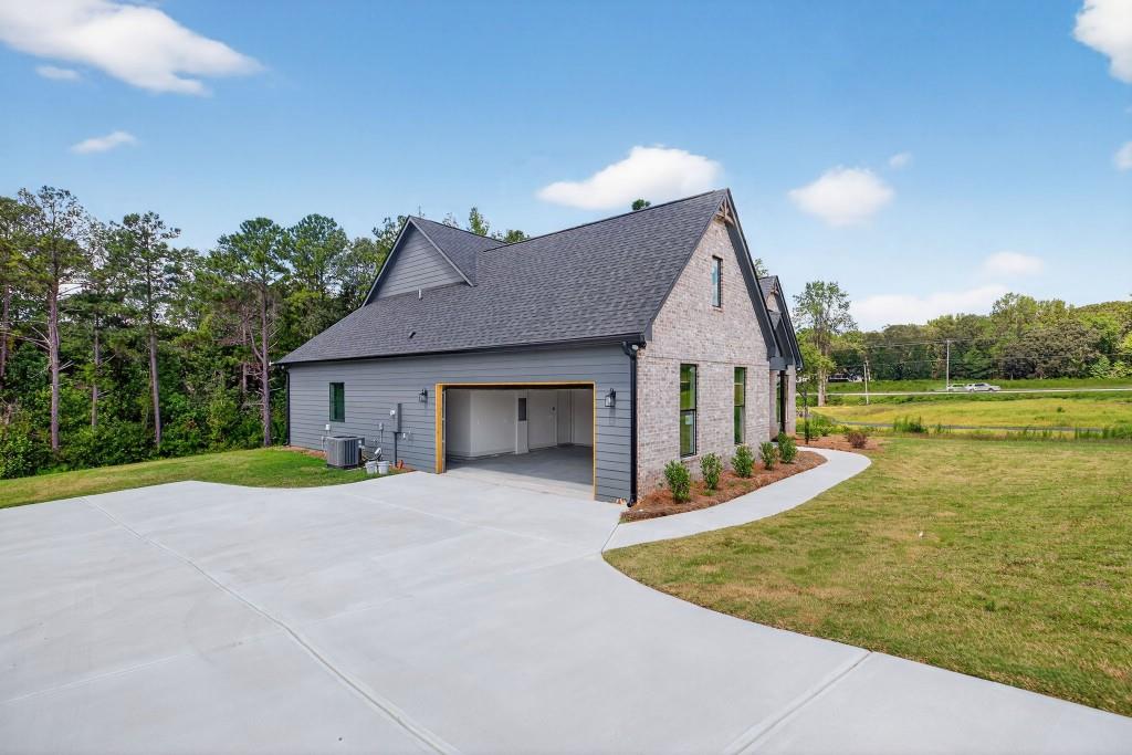 62 Ridgewood Creek Path Dallas, GA 30157 - Photo 3 of 31 a view of a house with pool and a yard