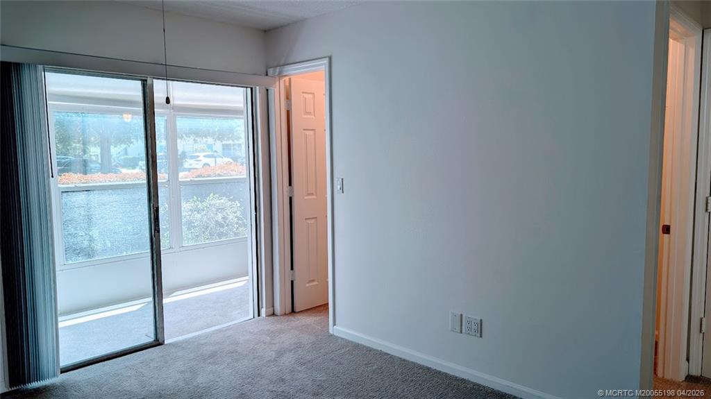 Undisclosed Address Stuart, FL 34996 - Photo 12 of 28 a view of an empty room and a window