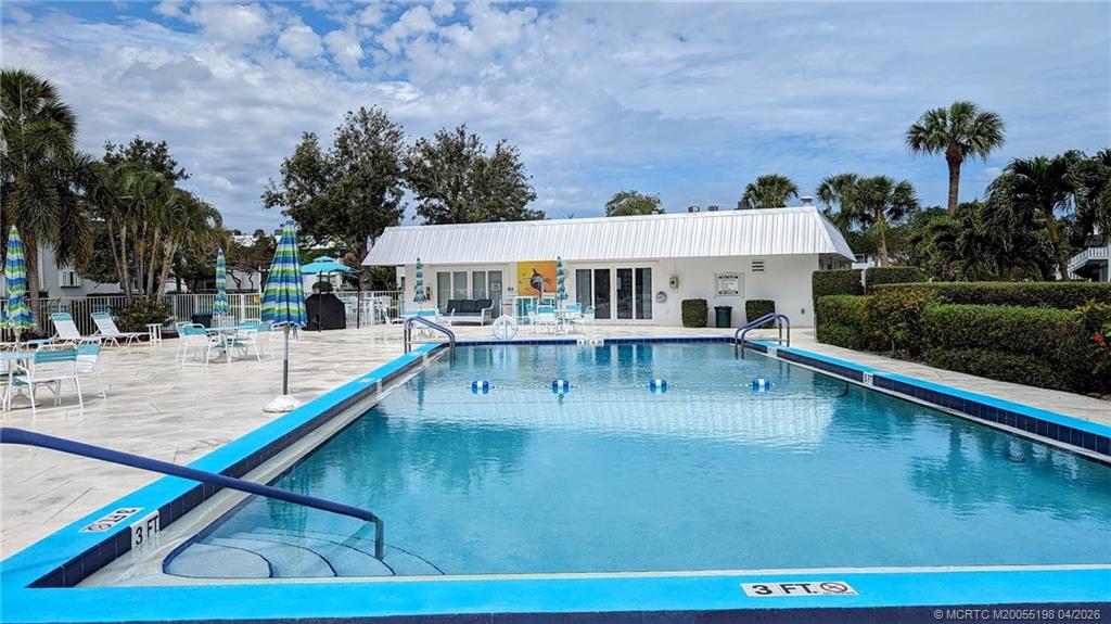 Undisclosed Address Stuart, FL 34996 - Photo 17 of 28 a view of a swimming pool with an outdoor seating