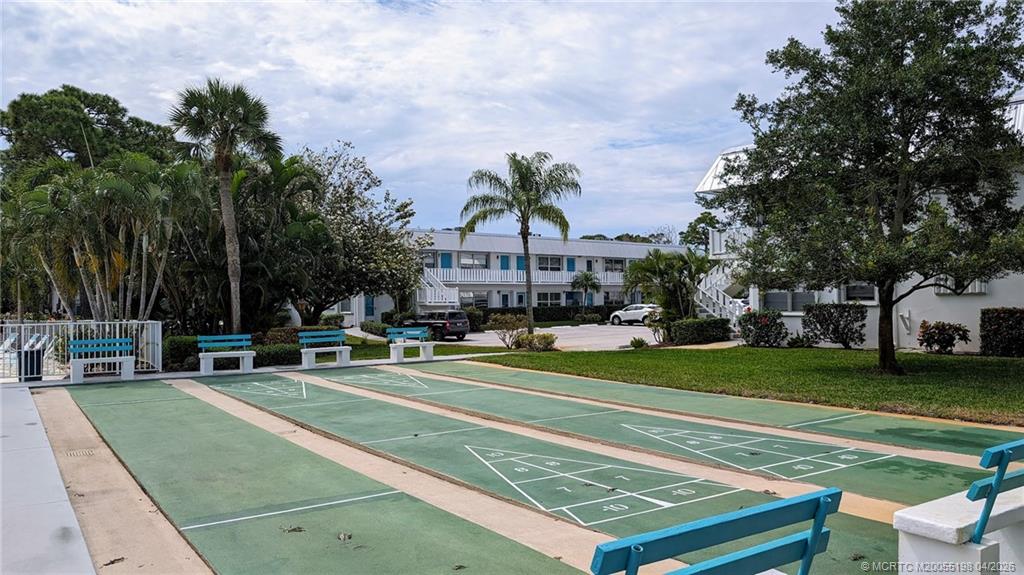 Undisclosed Address Stuart, FL 34996 - Photo 19 of 28 a view of a tennis ground with large trees