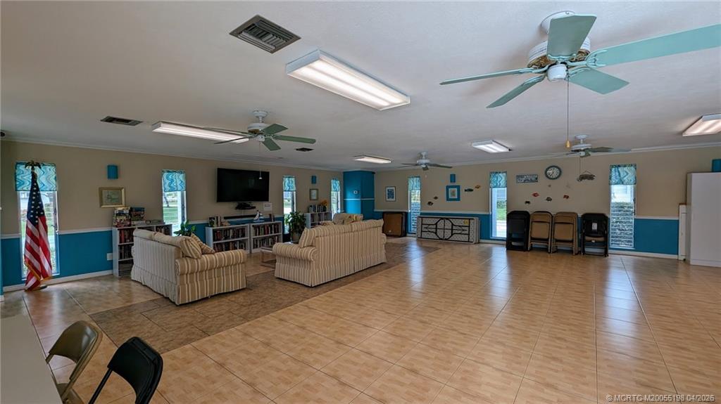 Undisclosed Address Stuart, FL 34996 - Photo 20 of 28 a living room with furniture and a wooden floor
