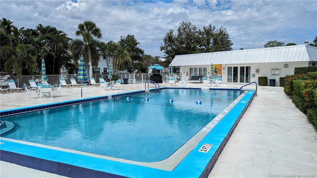 Undisclosed Address Stuart, FL 34996 - Photo 2 of 28 swimming pool view with a outdoor seating