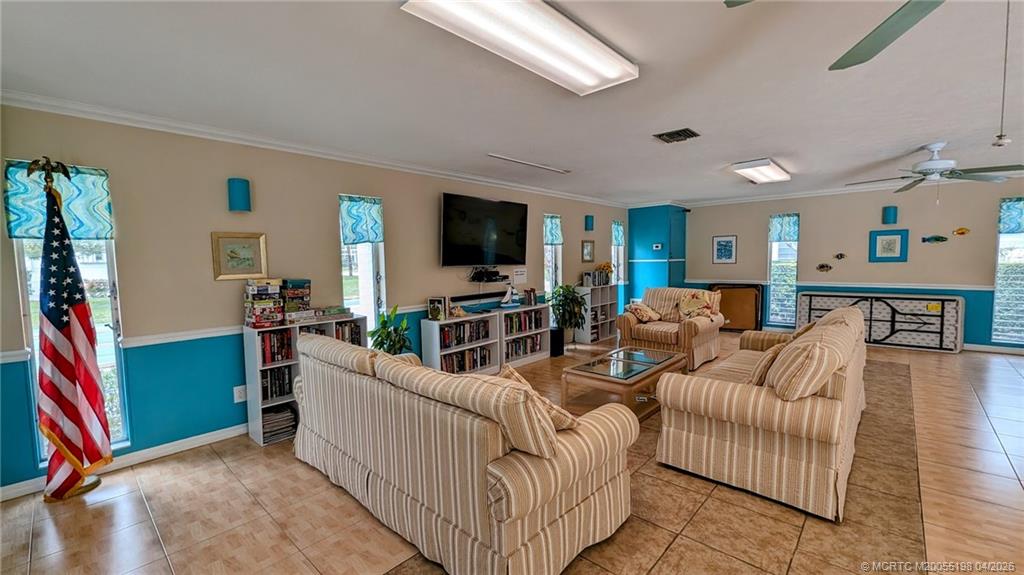 Undisclosed Address Stuart, FL 34996 - Photo 22 of 28 a living room with furniture and a flat screen tv