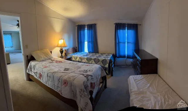 a bedroom with bed and window