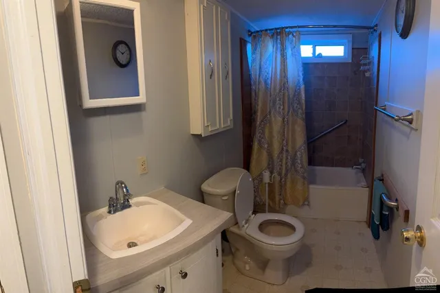 a bathroom with a toilet a sink and bathtub