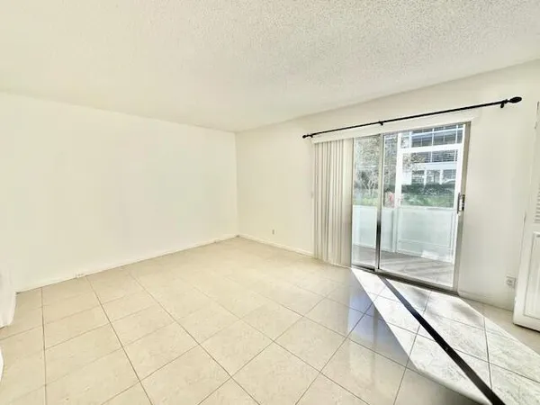 a view of an empty room and a glass door
