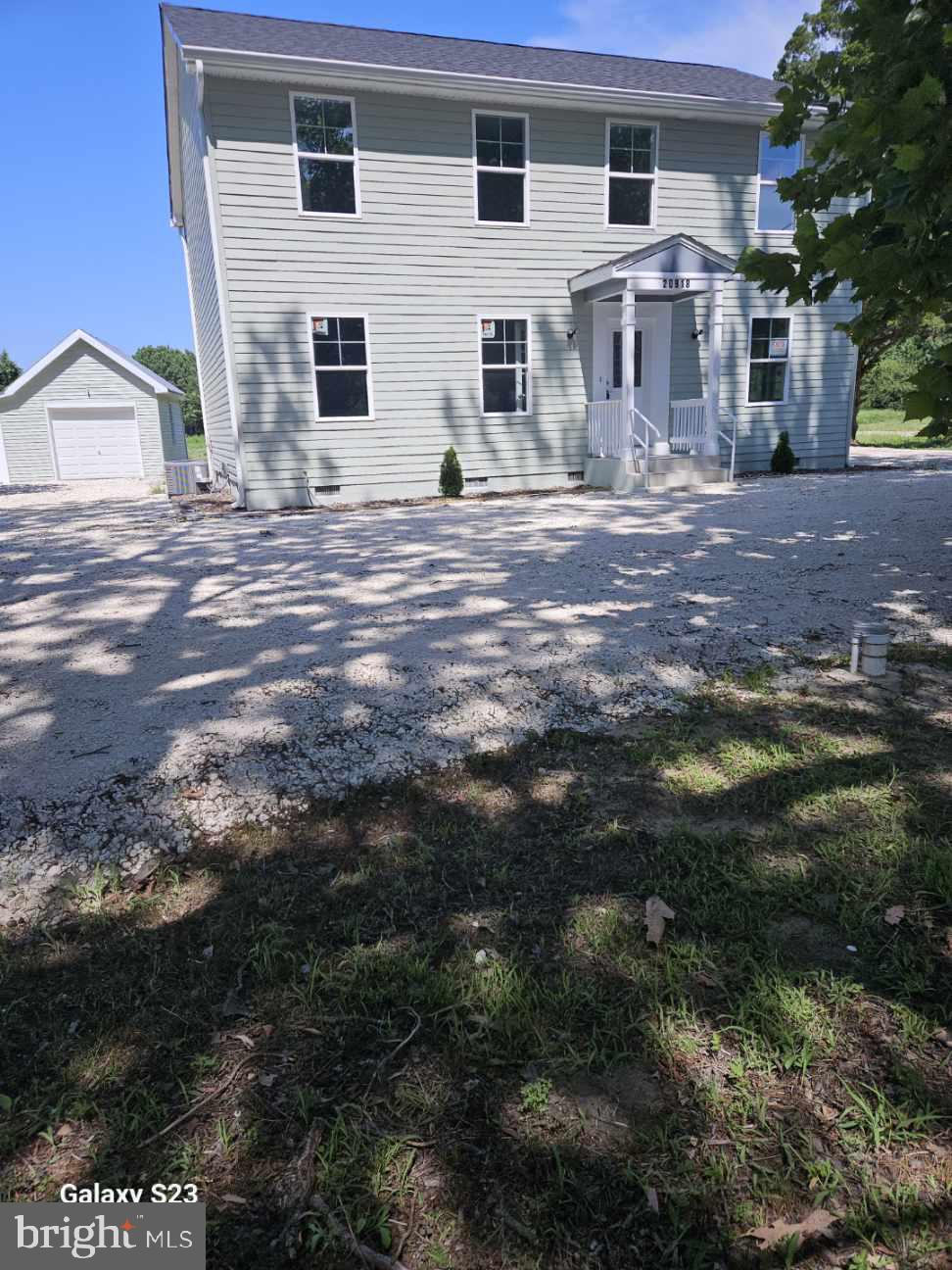 20918 Nanticoke Road Bivalve, MD 21814 - Photo 1 of 1 a front view of a house with a yard