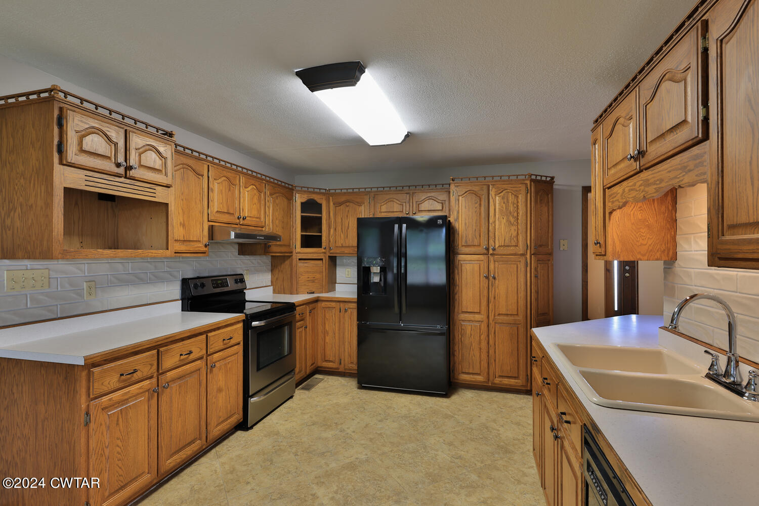 826 Old Salem Road Martin, TN 38237 - Photo 21 of 43 a kitchen with a refrigerator stove and sink