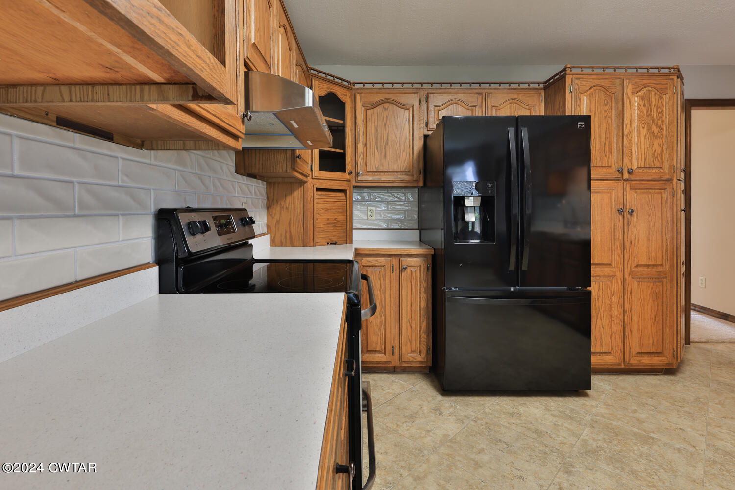 826 Old Salem Road Martin, TN 38237 - Photo 22 of 43 a kitchen with stainless steel appliances a refrigerator and a stove