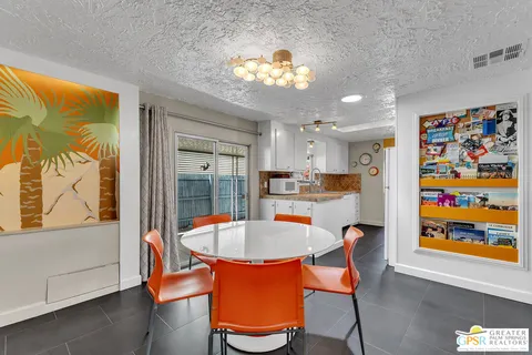 a kitchen with stainless steel appliances a sink and cabinets