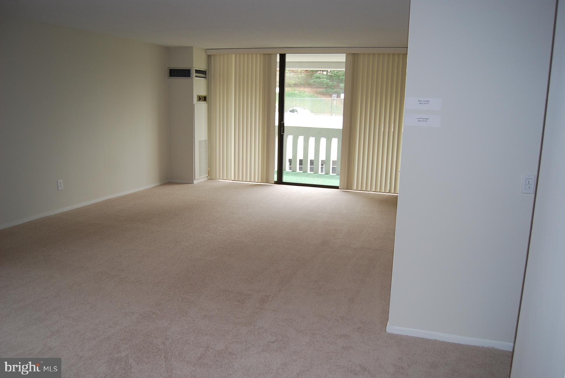 6101 Edsall Road, Unit 401 Alexandria, VA 22304 - Photo 2 of 32 Living room & Sliding Doors to Balcony