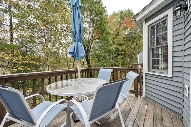 a deck with a table and chairs
