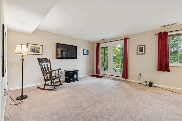 a view of a livingroom with furniture and windows