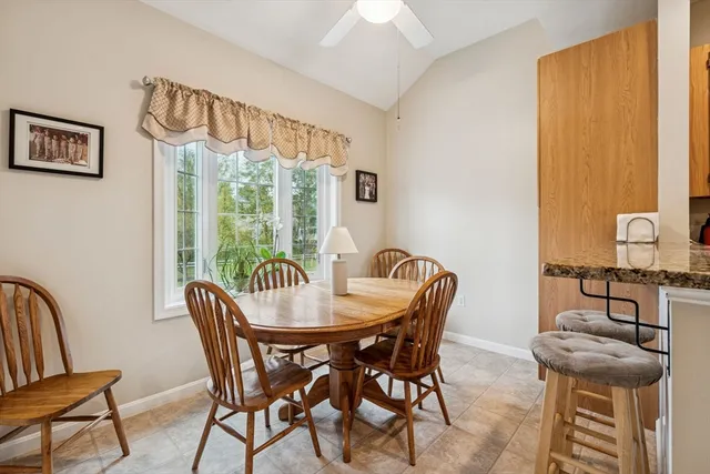 a view of a dining room with furniture window and outside view