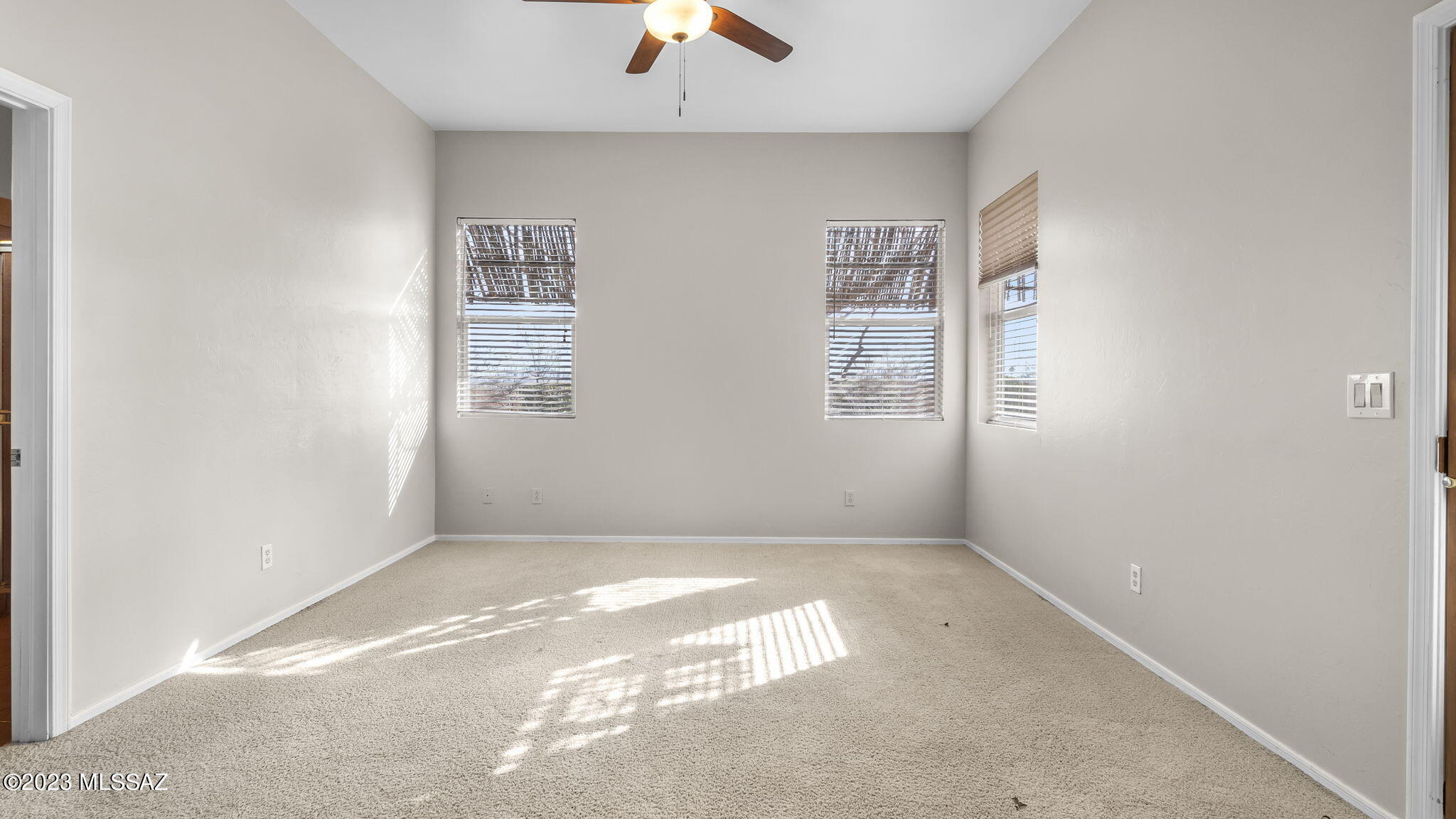 300 Circulo Bellagio Rio Rico, AZ 85648 - Photo 16 of 27 an empty room with windows and fan