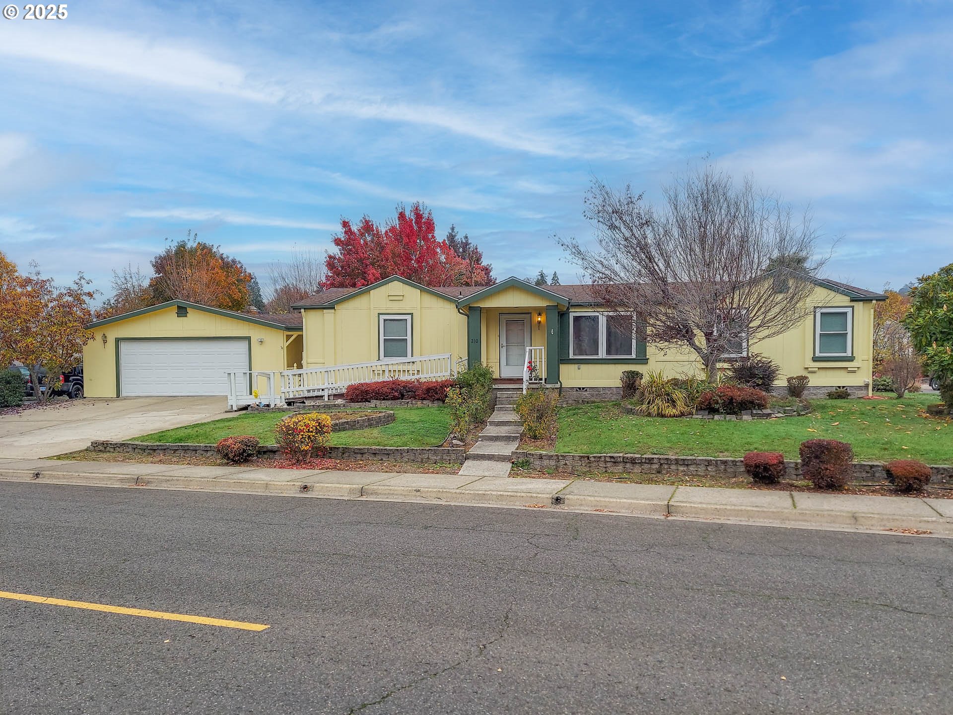 210 Northwest Timothy Avenue Winston, OR 97496 - Photo 1 of 38 a front view of a house with a yard and garage